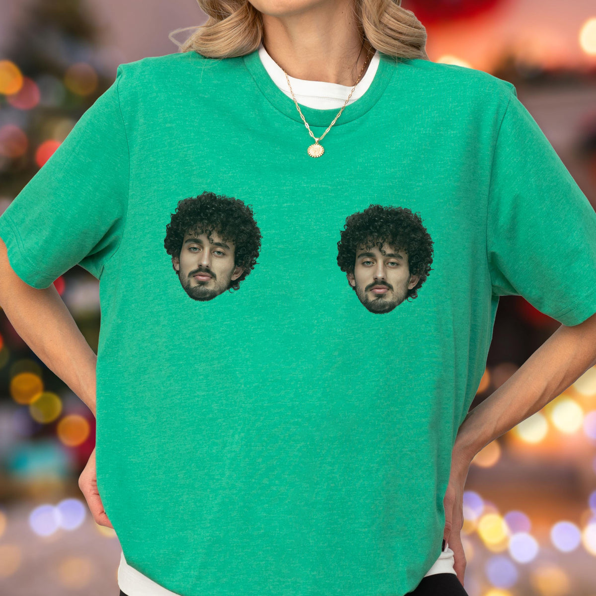 May include: A bright green short-sleeved t-shirt featuring two identical photographic prints of a person with dark curly hair and a beard. The shirt has a crew neckline and is worn with a thin gold chain necklace featuring a small circular pendant.