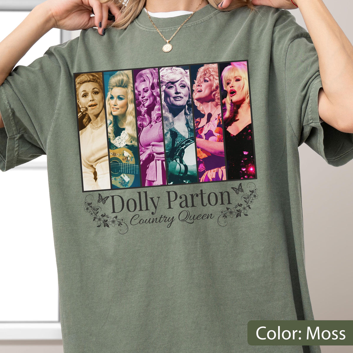 May include: A moss green t-shirt featuring a graphic print of six vertical panels displaying various images of Dolly Parton. Below the panels, the text reads Dolly Parton Country Queen, accompanied by small butterfly and floral illustrations.