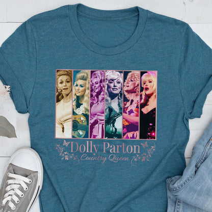 May include: A teal short-sleeved t-shirt featuring a graphic print of six vertical panels showing different portraits of Dolly Parton. Below the images, the text reads "Dolly Parton" and "Country Queen" in a light pink font with butterfly accents.