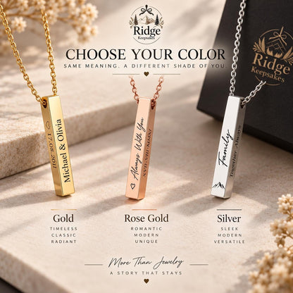 three personalized metal pendants in different colors, each with a unique message engraved on it. The pendants are arranged on a surface, with a black box in the background.