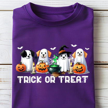 May include: A purple t-shirt featuring a Halloween design. The graphic includes four dogs dressed as ghosts, pumpkins, candles, bats, a witch's cauldron, and the text "TRICK OR TREAT" in white.