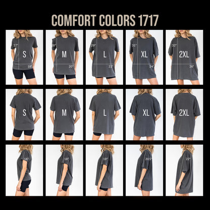 May include: A Comfort Colors 1717 t-shirt size chart displaying front, back, and side views of a charcoal grey shirt in sizes S through 2XL. The image includes white text labels for sizes and white lines indicating measurements in inches.