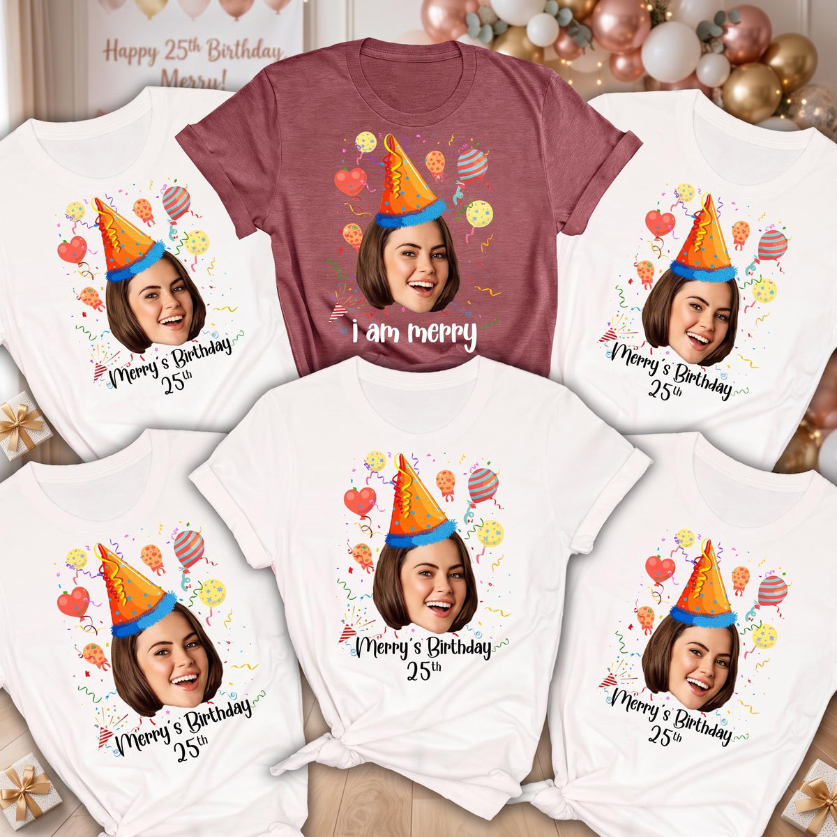May include: A collection of five short-sleeved t-shirts, one maroon and four white, each featuring a graphic of a person wearing an orange party hat surrounded by colorful balloons and confetti, with the text Merry's Birthday 25th or i am merry.