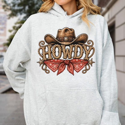 May include: A light gray hooded sweatshirt featuring a graphic print of a brown cowboy hat, a red patterned bandana, and the word HOWDY written in a rope-style font. The design includes two small star icons on the left and right sides.