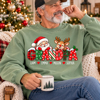 May include: A sage green crewneck sweatshirt featuring a graphic of Santa Claus and a reindeer above the word GRANDPA in festive patterns. The names Liam, Emma, Mason, and Sophia are printed below in white text separated by small red hearts.