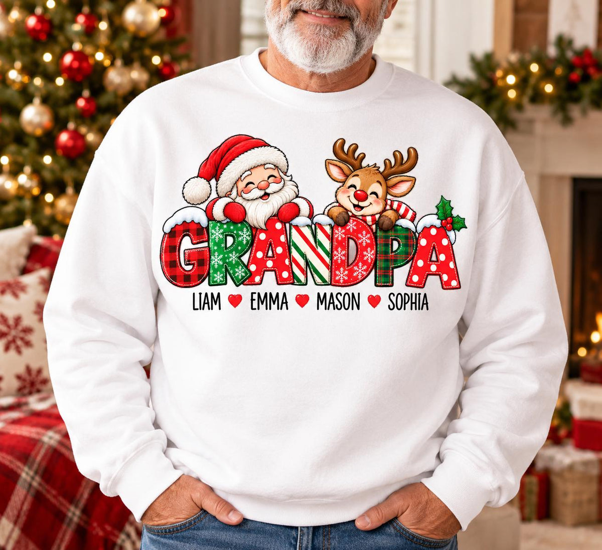 May include: A white crewneck sweatshirt featuring a graphic of Santa Claus and a reindeer peeking over the word GRANDPA in red, green, and white patterns. Below the text are the names Liam, Emma, Mason, and Sophia separated by red hearts.